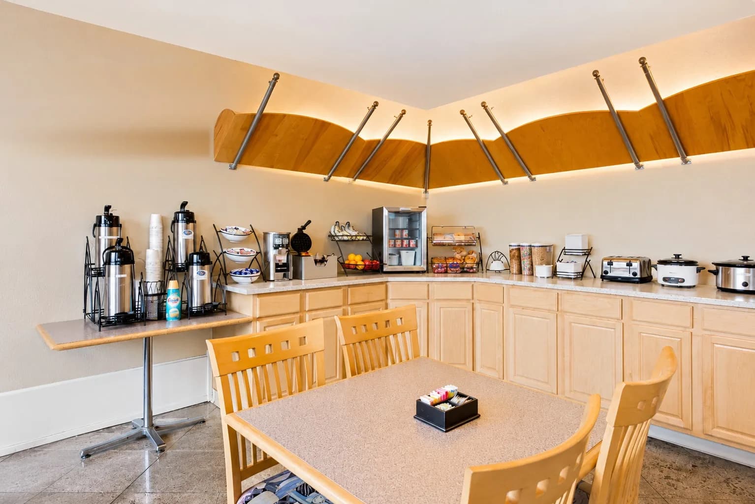 Breakfast area with the buffet counter, coffee station and dining tables
